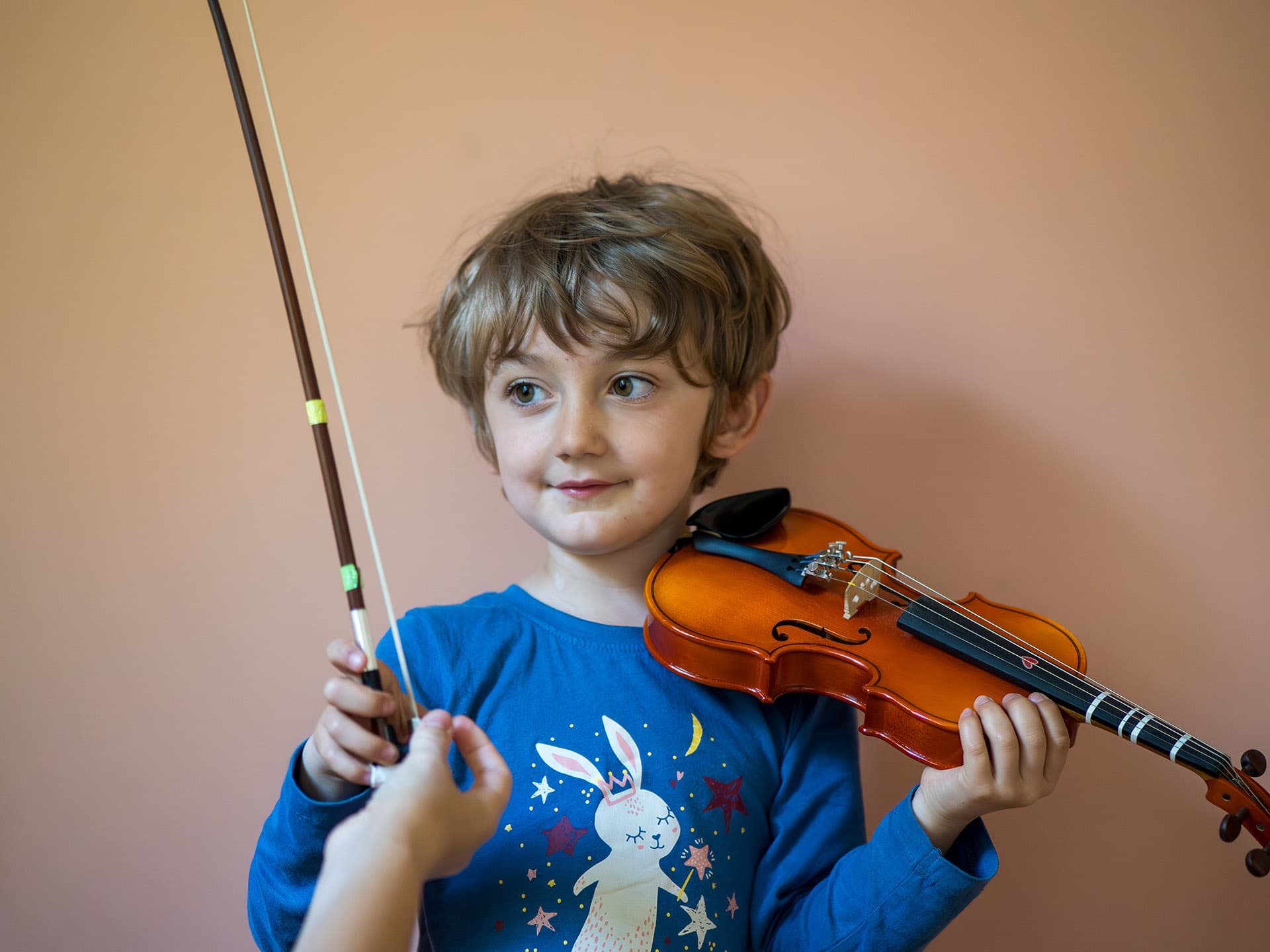 Boy taking violin lessons in Stockholm
